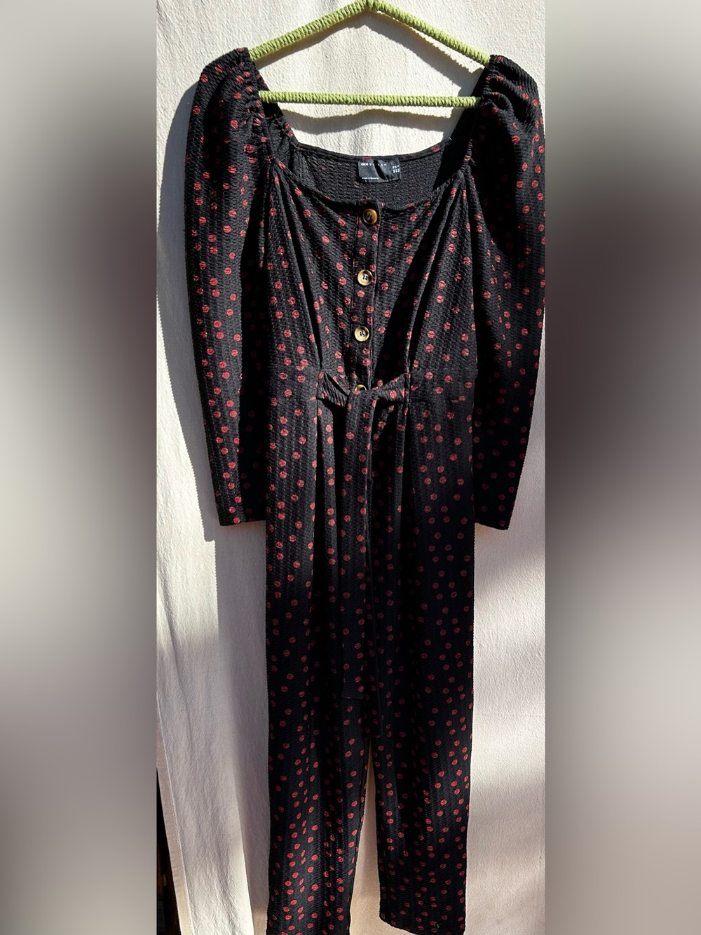 Black Jumpsuit with Red Polka Dot Print and Button Front